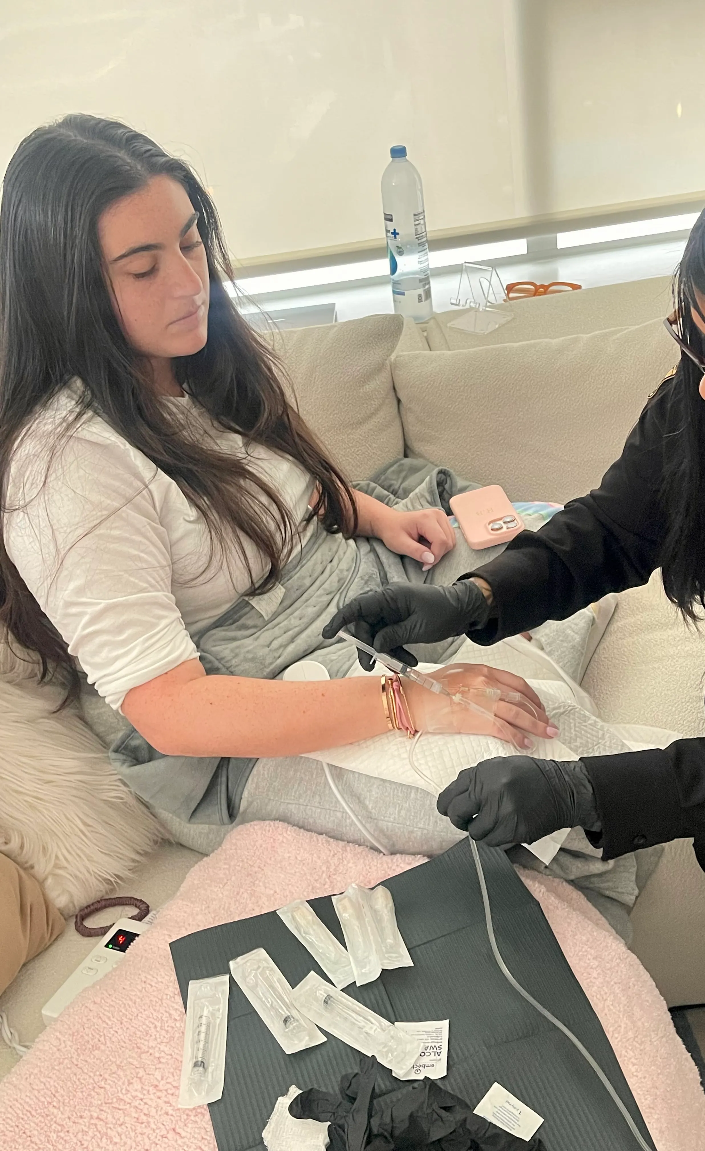 Client resting at home during a morning-after recovery IV