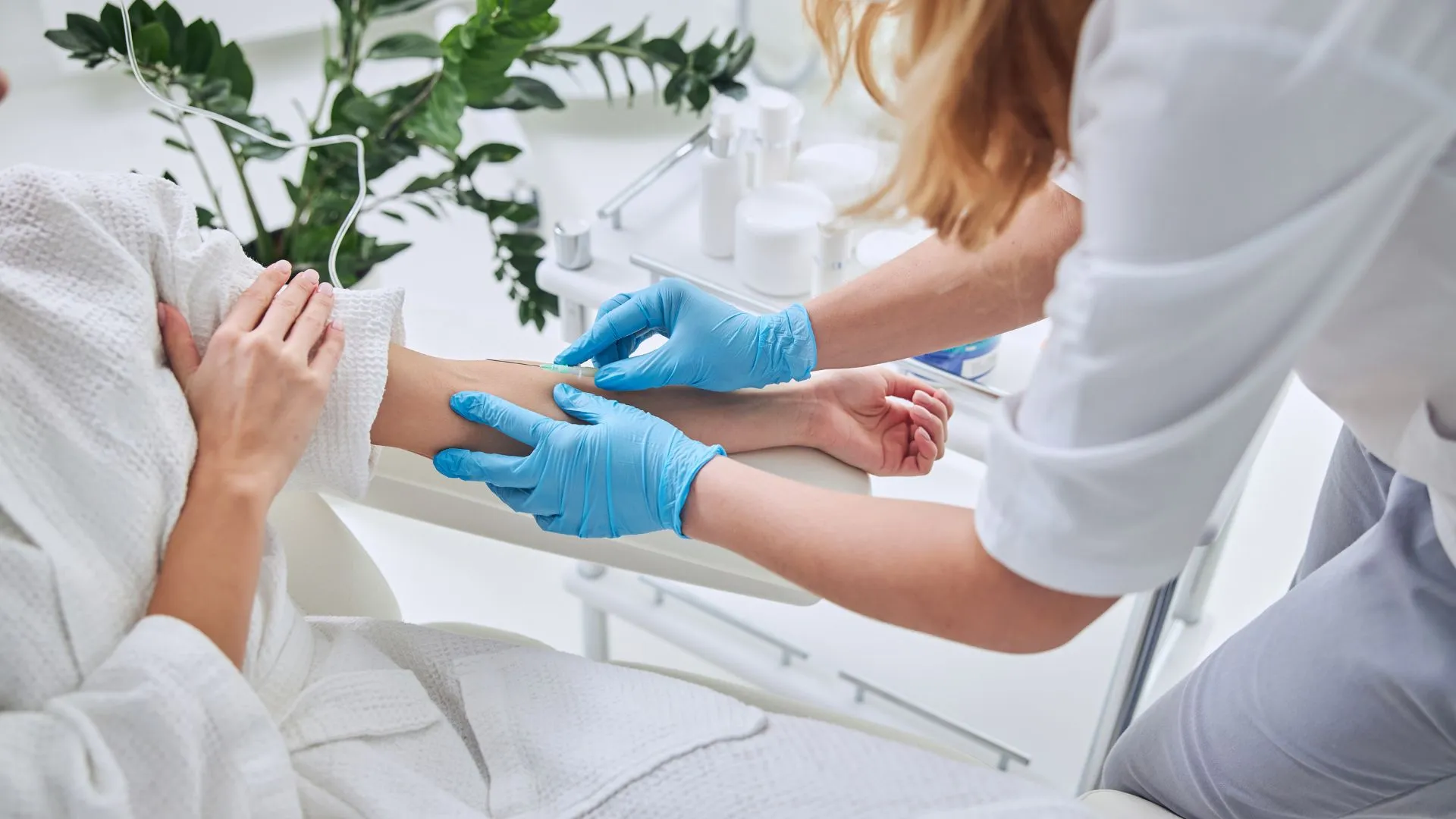 Licensed clinician placing an IV line for a client in White Plains