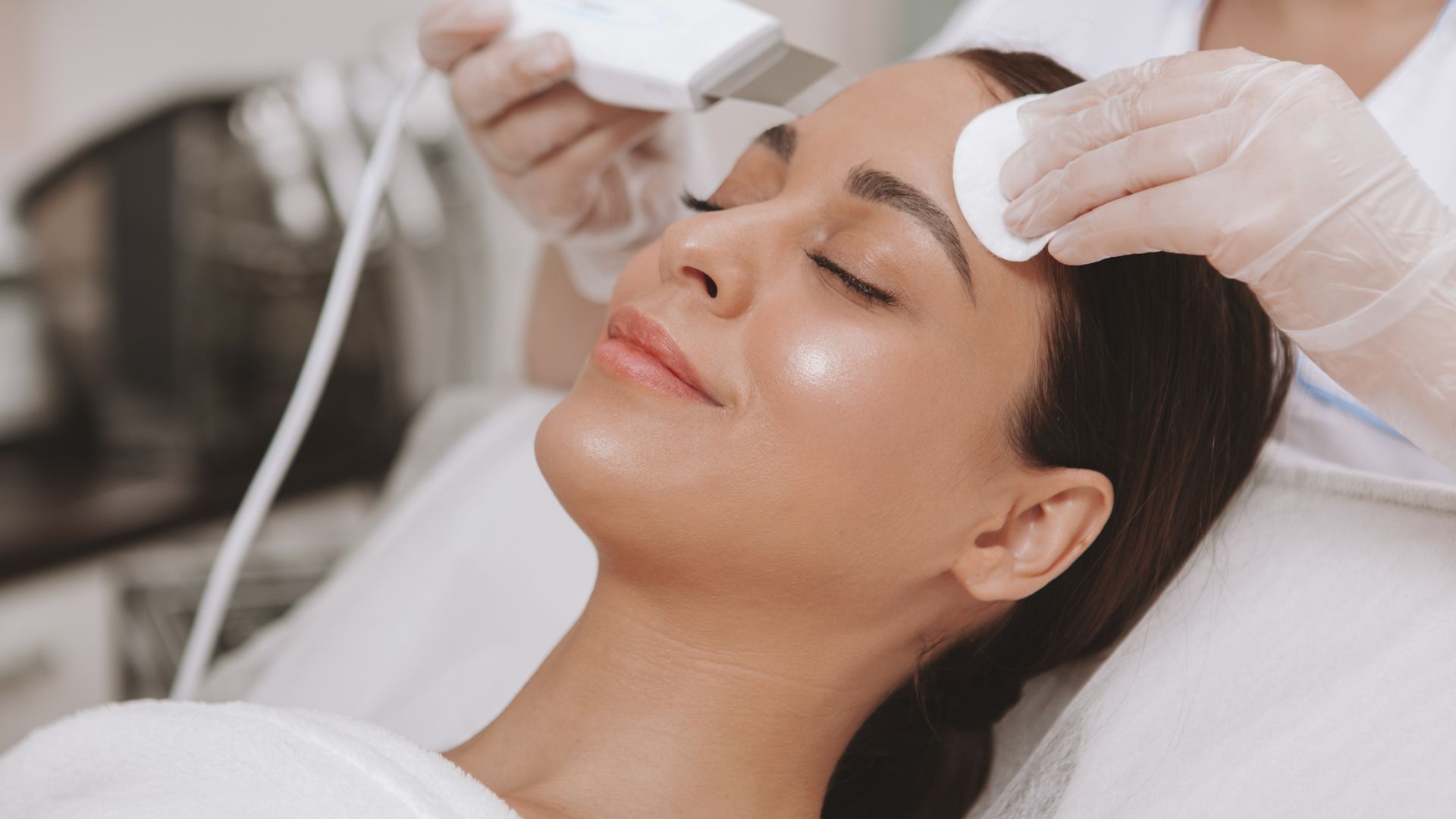 A client receiving a germicidal High Frequency treatment to target acne bacteria.