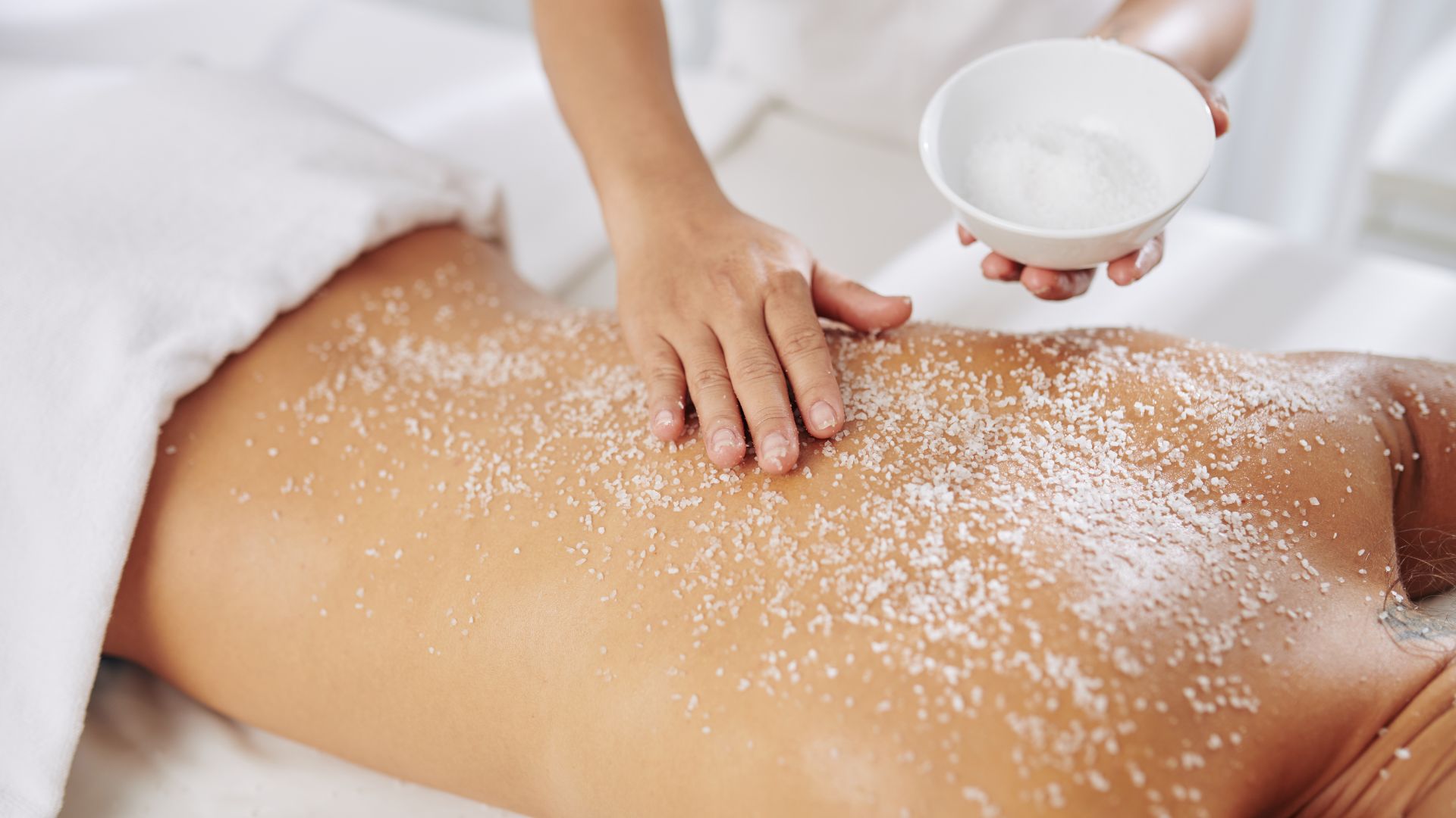 Client receiving a professional exfoliation facial treatment.