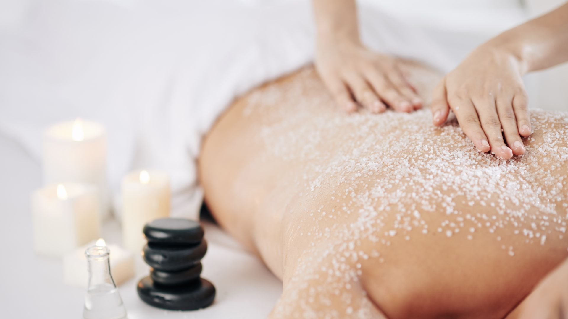 A soothing mask being applied during a professional back facial treatment.